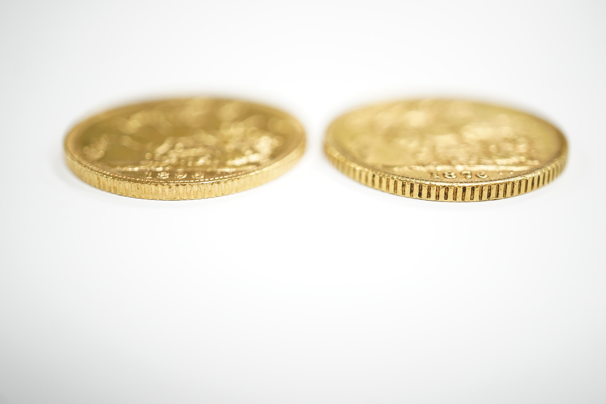 British gold coins, Victoria, two gold sovereigns, 1876, near fine and 1896, fine or better (2)